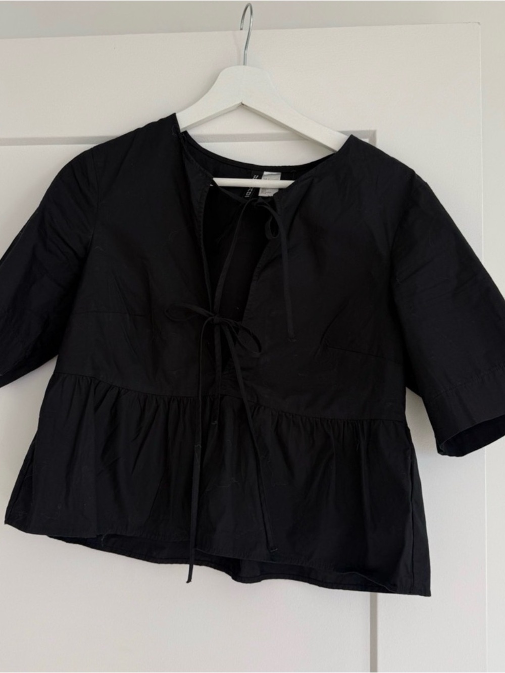 Divided Black Tie-Front Peplum Blouse